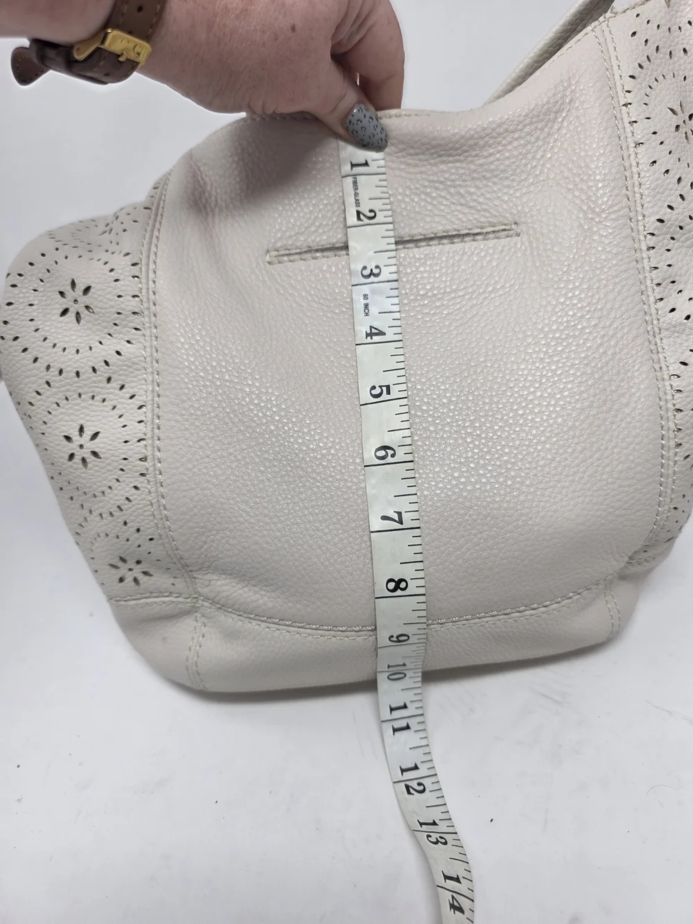 ​The Sak Off White Pebbled Leather Hobo Bag Perforated Cutout Tassel